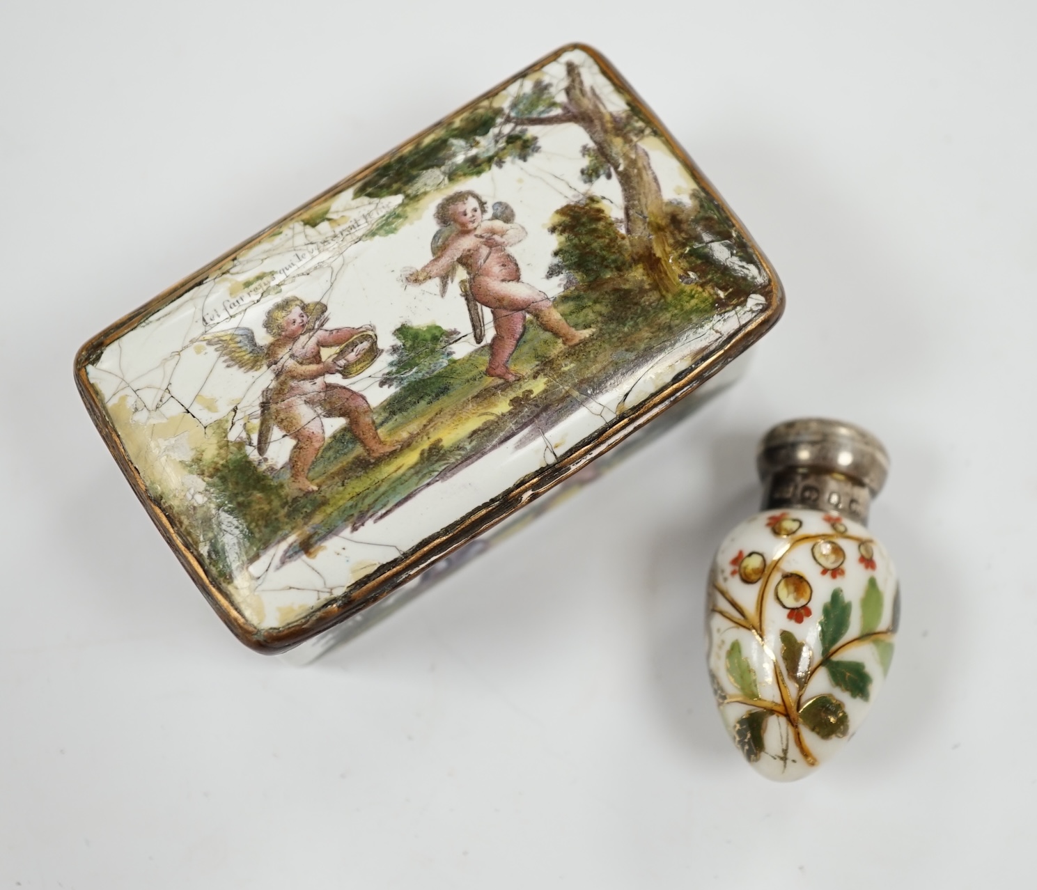 An 18th century French enamel snuff box and a late 19th century silver mounted porcelain scent bottle, largest 7.5cm. Condition - box poor, scent bottle fair
